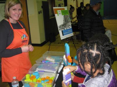 Student and volunteer at Family Science Night